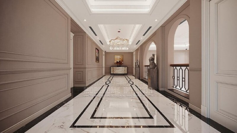 Thiết kế hành lang đẹp ấn tượng từ sàn lát đá cao cấp, phào chỉ tường đẹp cùng đèn trang trí pha lê ấn tượng. thiết kế biệt thự