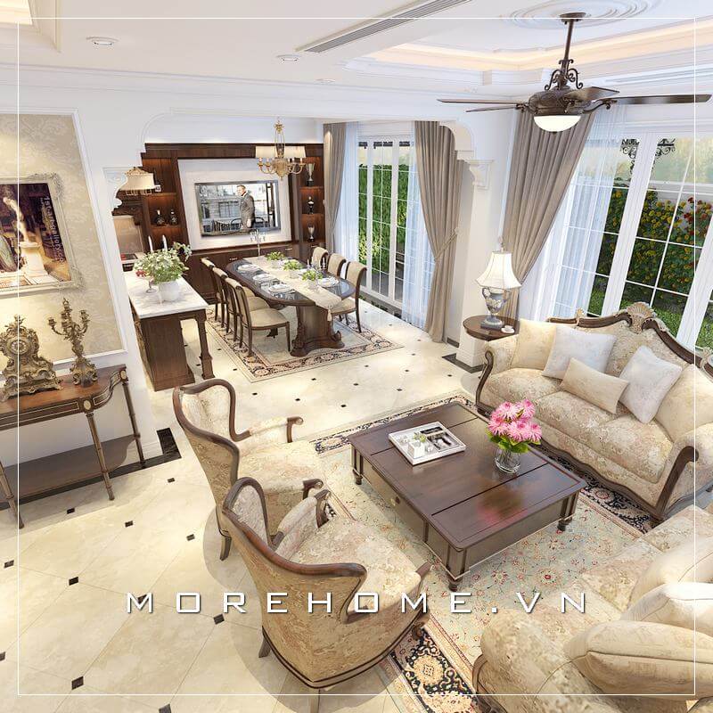 Mẫu thiết kế phòng khách liền kề bếp tân cổ điển và được ngăn cách bởi bộ bàn ăn đang được nhiều gia chủ ưa chuộng và sử dụng cho không gian sinh hoạt chung tiện nghi hơn. Thiết kế biệt thự
