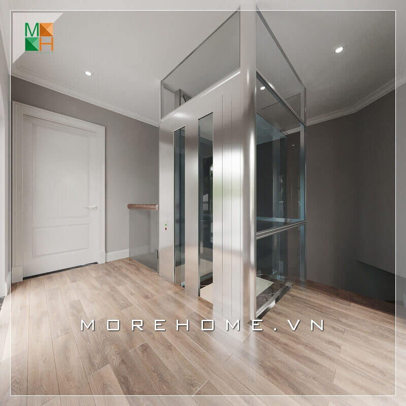 Với thiết kế thang máy kính cường lực trong suốt làm tăng thêm sự hiện đại, sang trọng cho căn biệt thự. thiết kế biệt thự